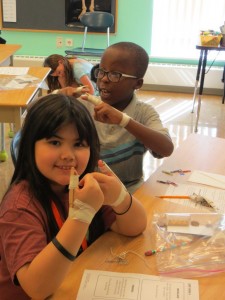 Caroline and Jacob learning what life without opposable thumbs would be like.