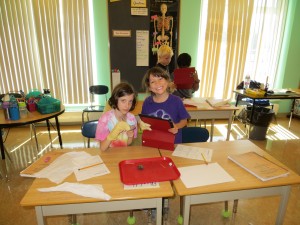 Chloe and Ashley dissecting an owl pellet.