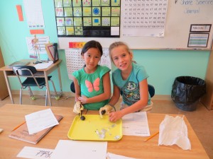 Elly, Sofia, and their owl pellet.  