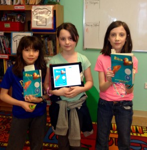 Chloe, Gabby, and Ashley are reading Rules by Cynthia Lord