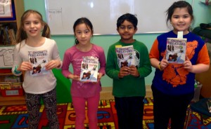 Sofia, Elly, Rohit, and Caroline are reading Snow Treasure by Marie McSwigan.